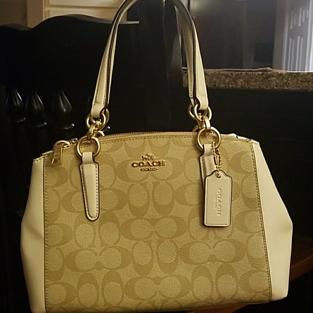 Bought BRAND NEW MINI CHRISTIE CARRYALL, but used no signs of wear.
